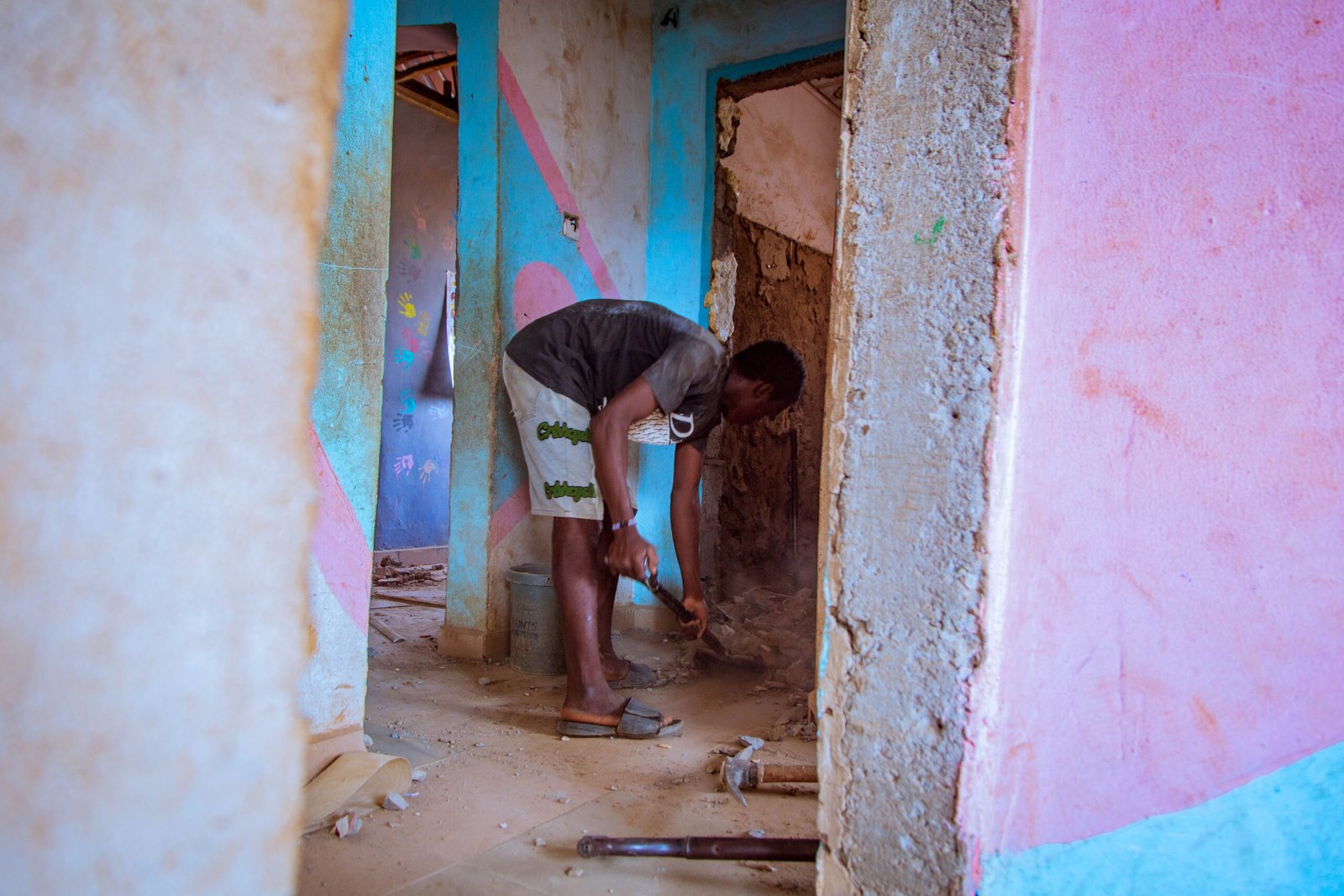 worker cleaning and preparing space for children