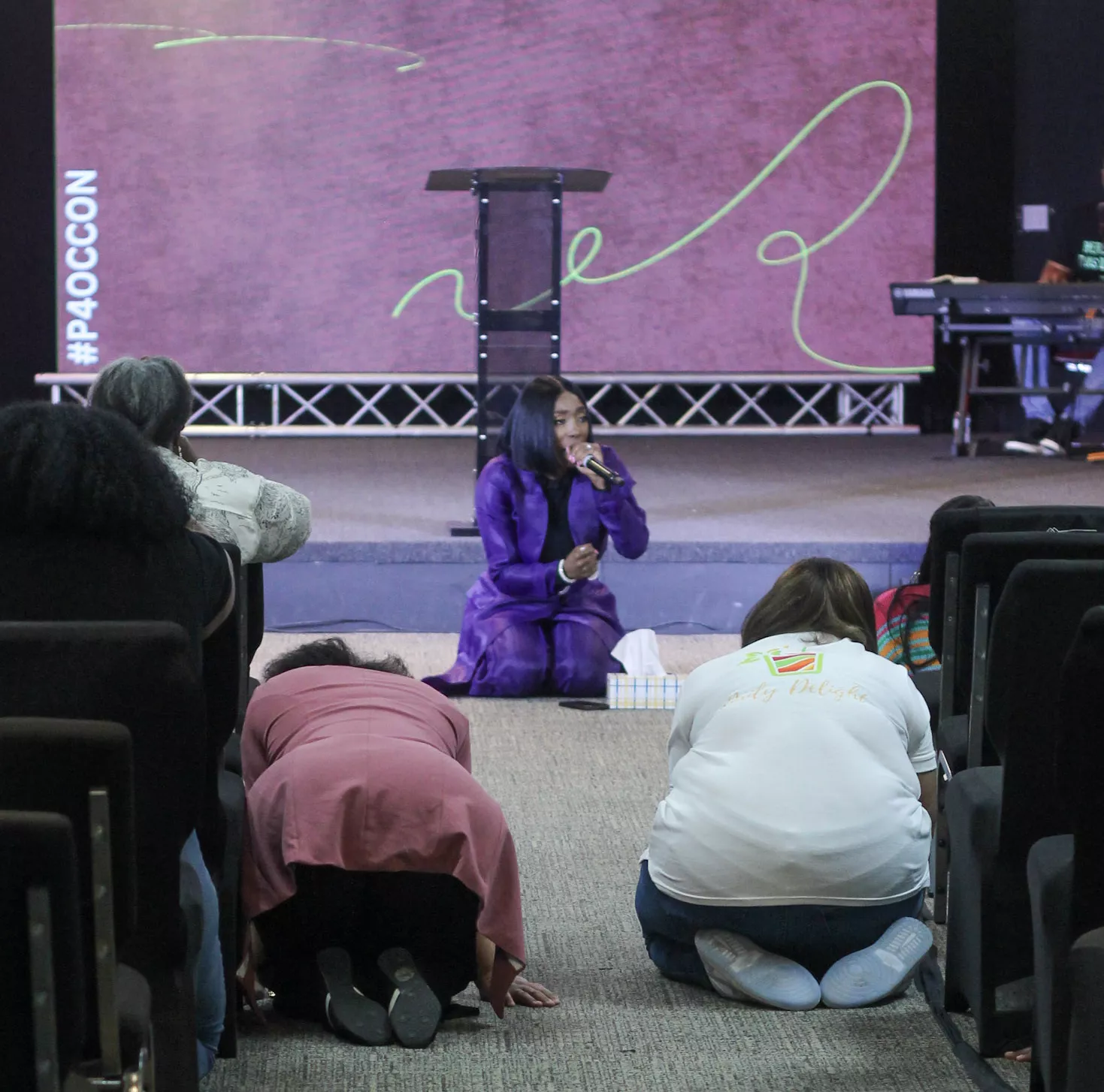 children charity conference stage event with audience and speaker