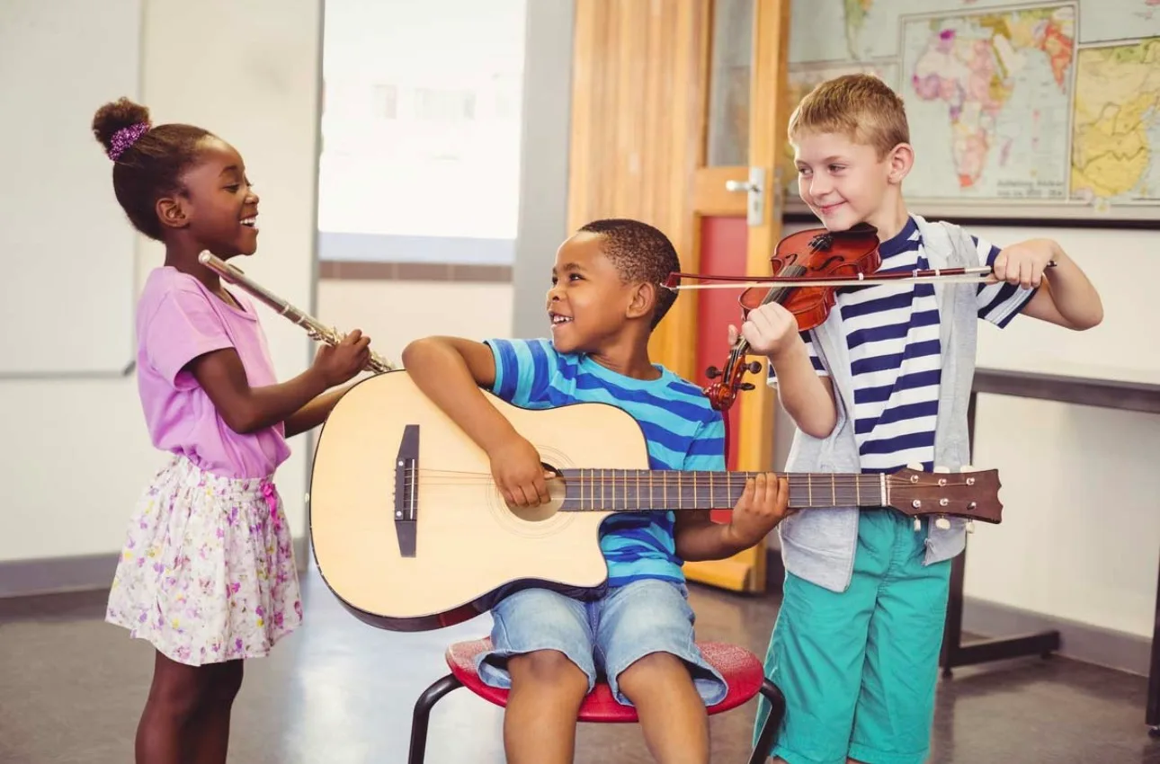 children learning music through education support program